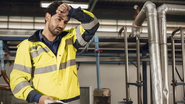 Tired engineer worker hard work fatigue male staff factory hot weather