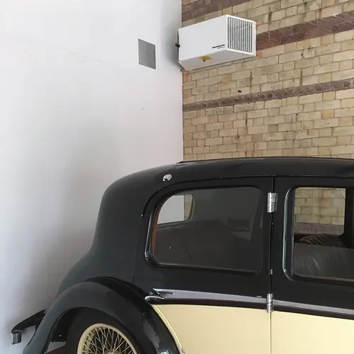 Calorex DH 15 dehumidifier installed in a classic car garage